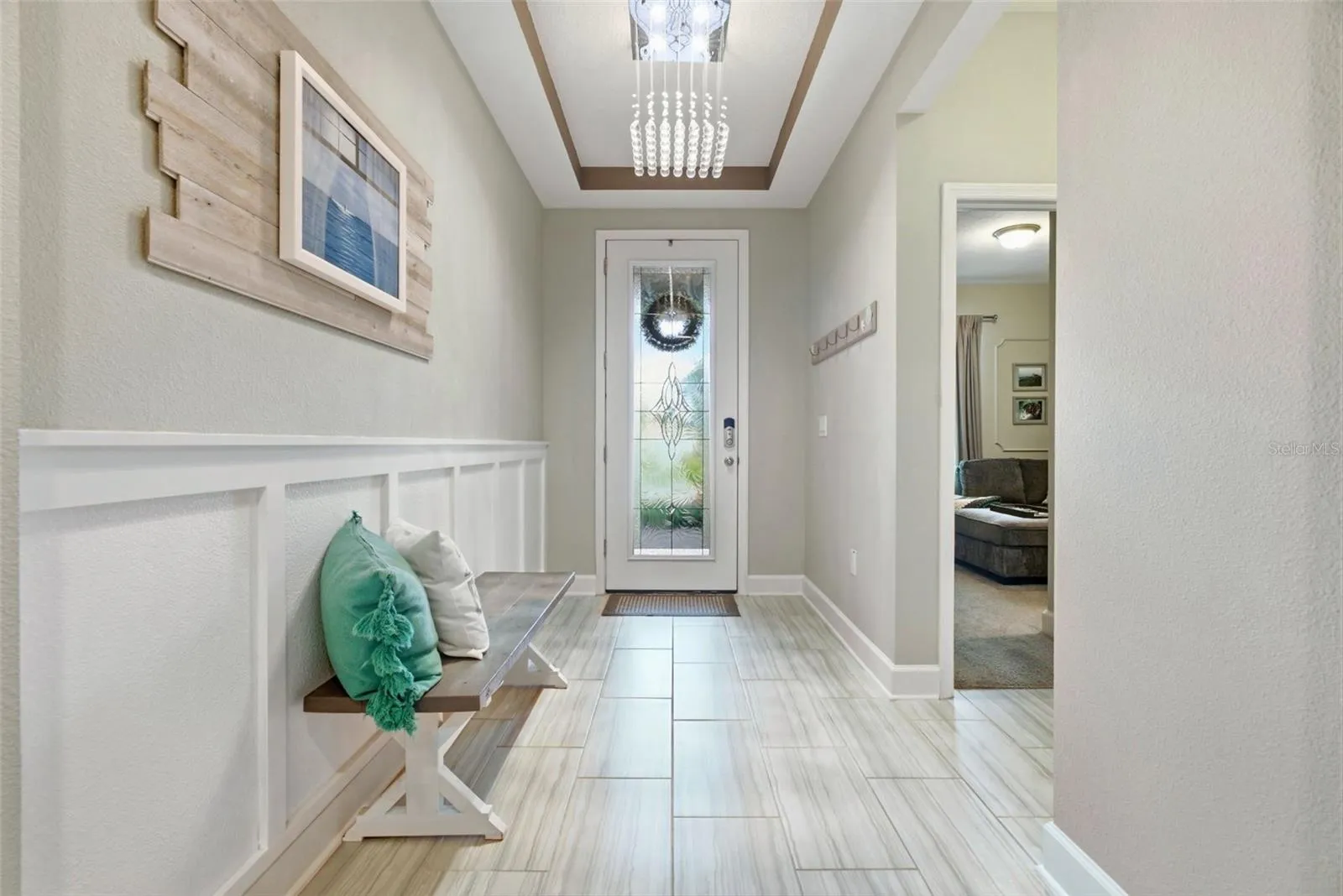 Elevated design details continue down the main hallway, leading naturally into the main living areas