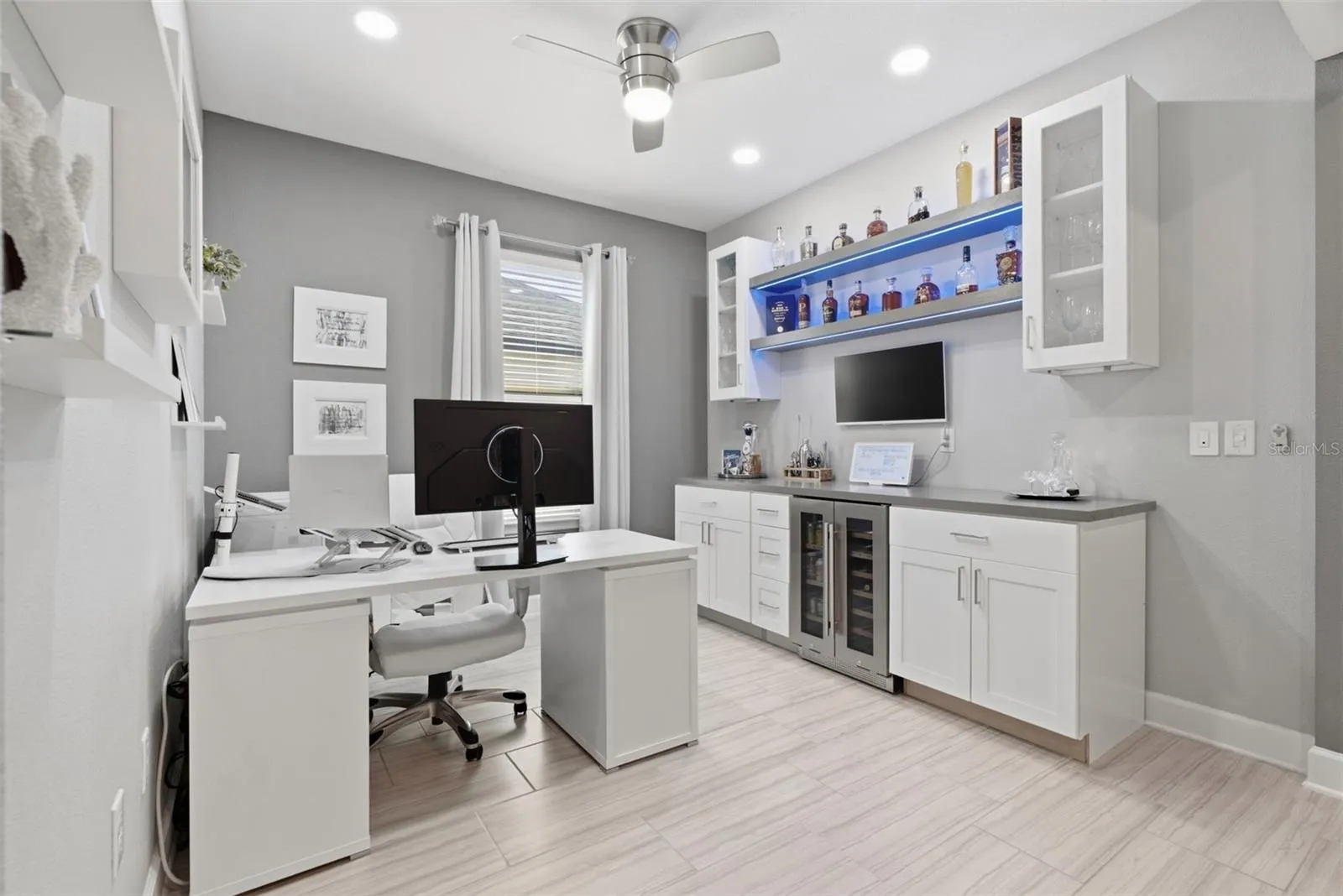 Flex room separate from bedrooms, featuring built-in shelving.
