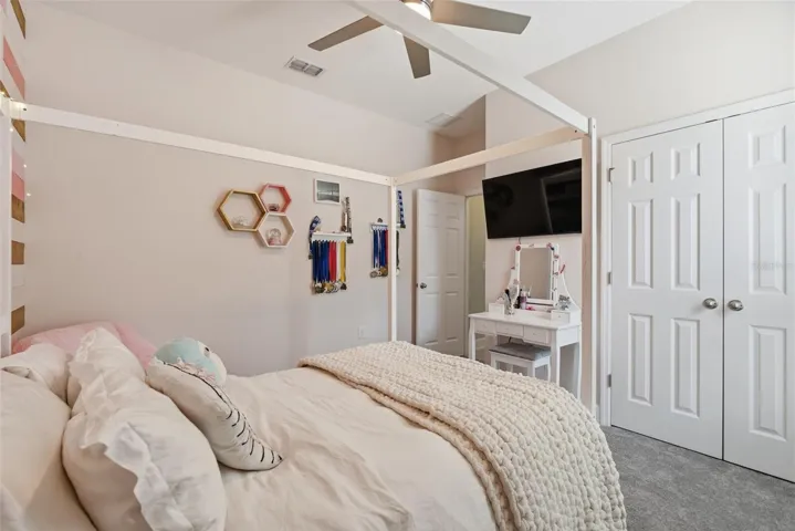 Comfortable bedroom 2 featuring brand-new carpeting and ample natural light