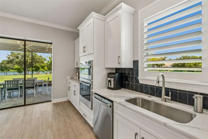 Window to Lake with Wood Shutters