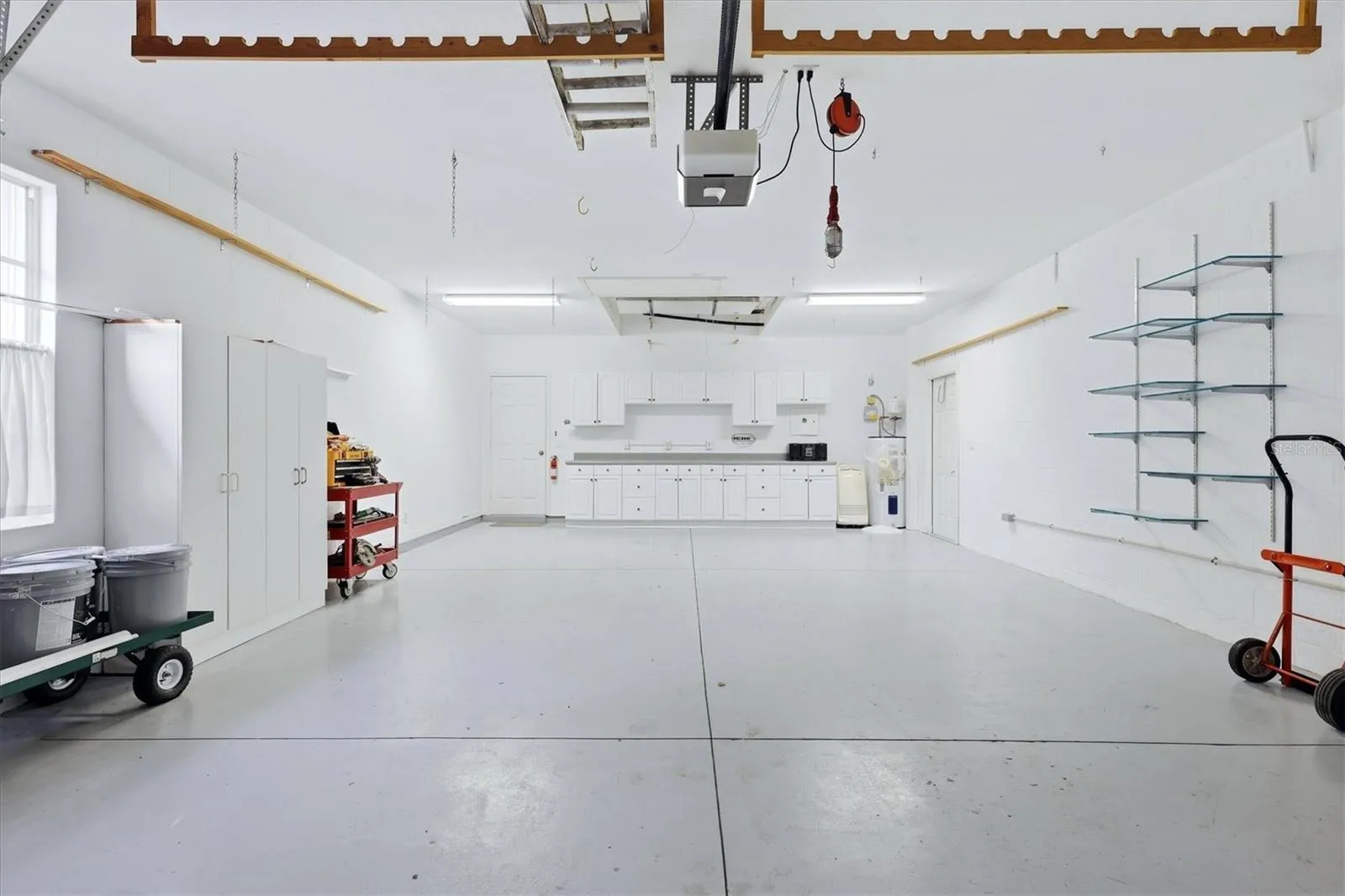 Large Garage with Cabinets / Shelving