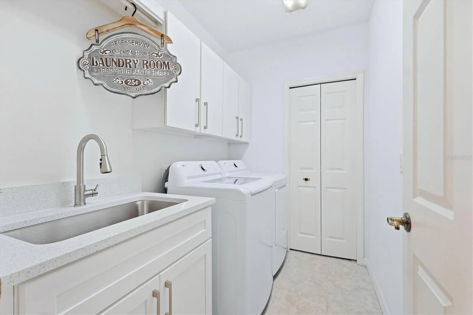 Laundry room with utility closet