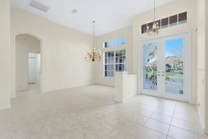 Front Door/Formal Dining to hall / garage
