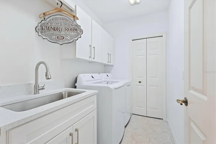 Laundry room with utility closet