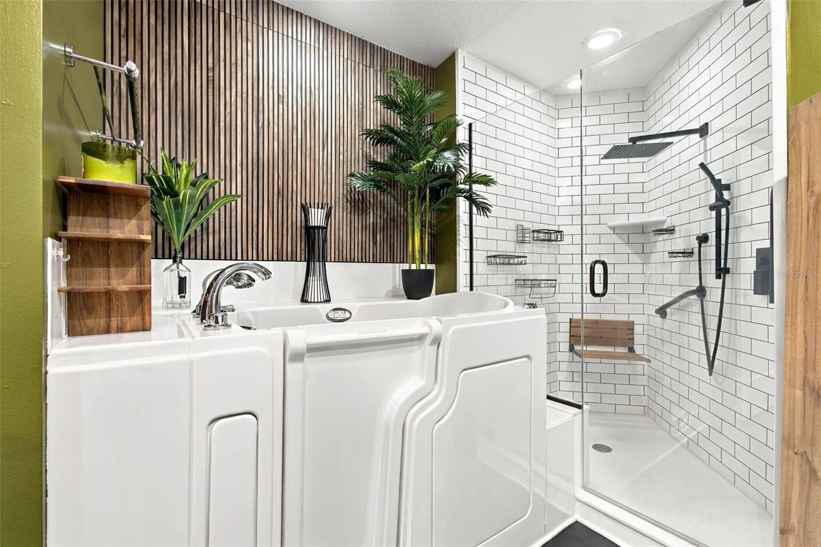 Walk in shower with rain shower head and teak seat