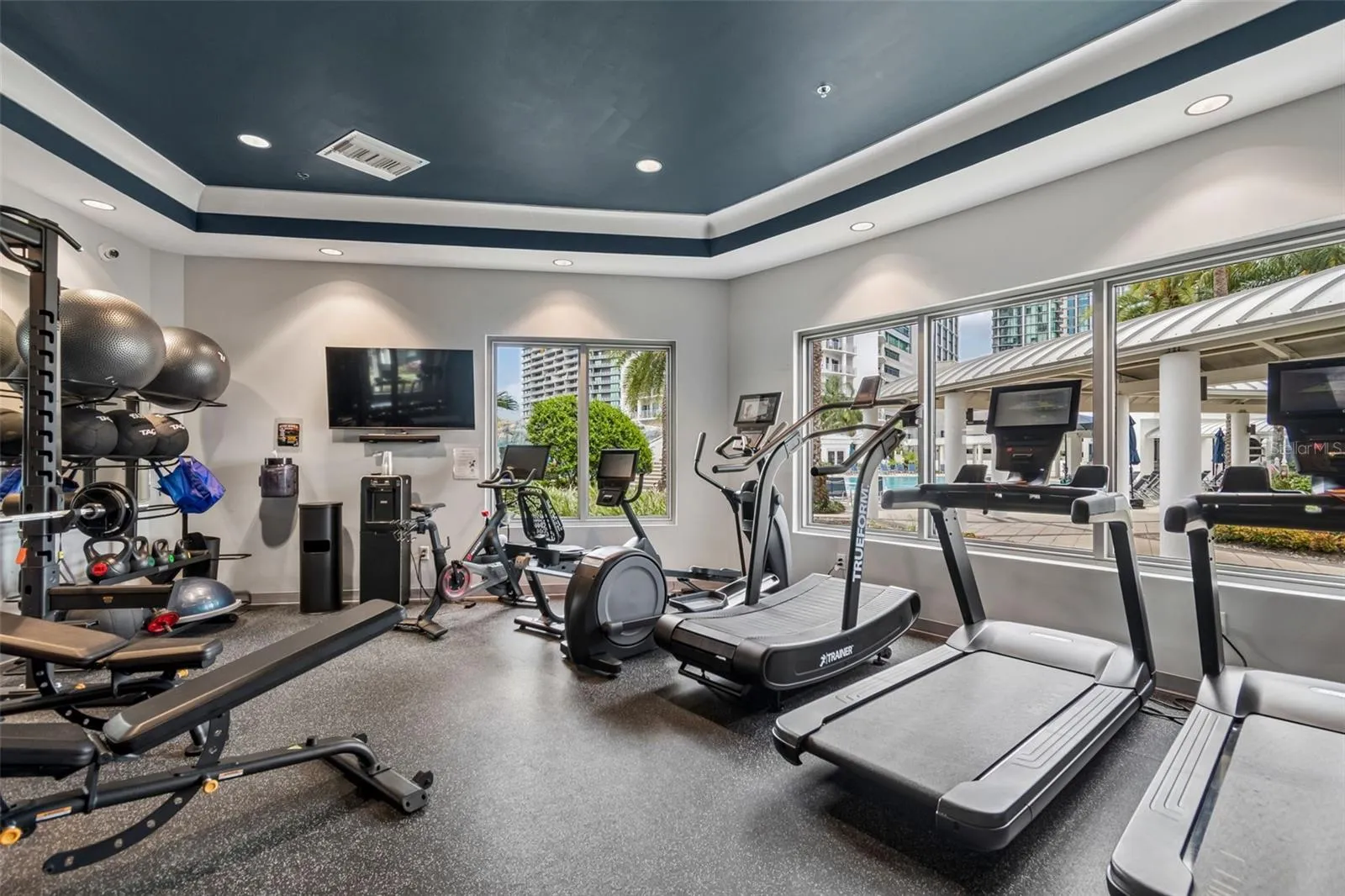 New gym overlooking the beautiful pool area