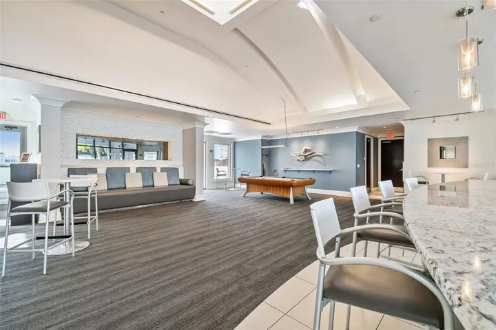 Spacious clubhouse with catering kitchen, bar area, TV and pool table