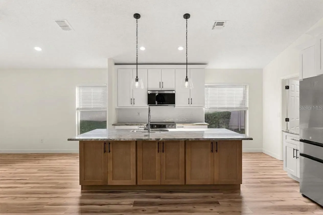 Beautiful kitchen island with quartz and new cabinets