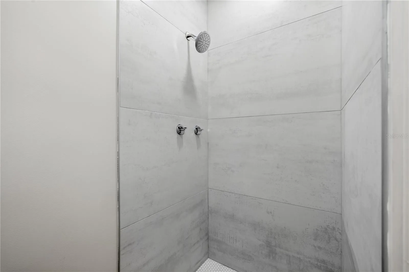 The half bath features a full shower