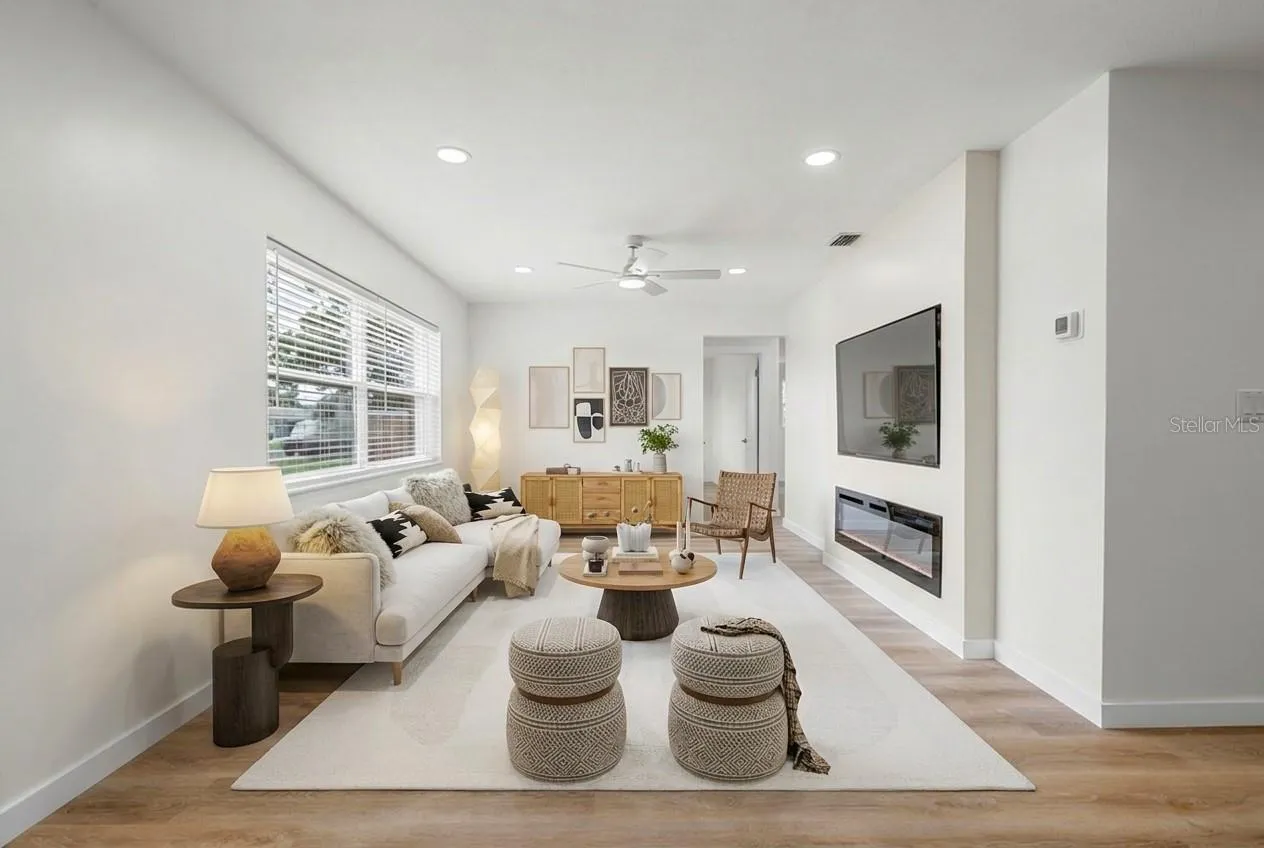 Open living space with custom built in fireplace and brand new 65” Samsung TV
