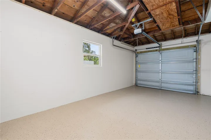 Ample sized garage with epoxy flooring