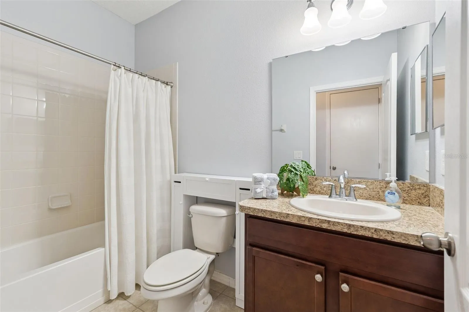 Bathroom #3 offers a comfort height vanity with tub/shower unit