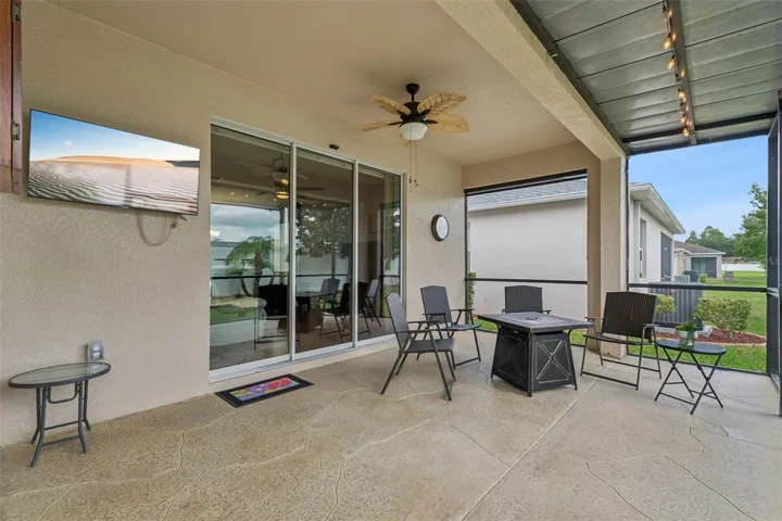Extended Screened lanai features decorative stamped concrete flooring