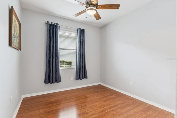 Junior Bedroom Suite with upgraded ceiling fan that includes a remote