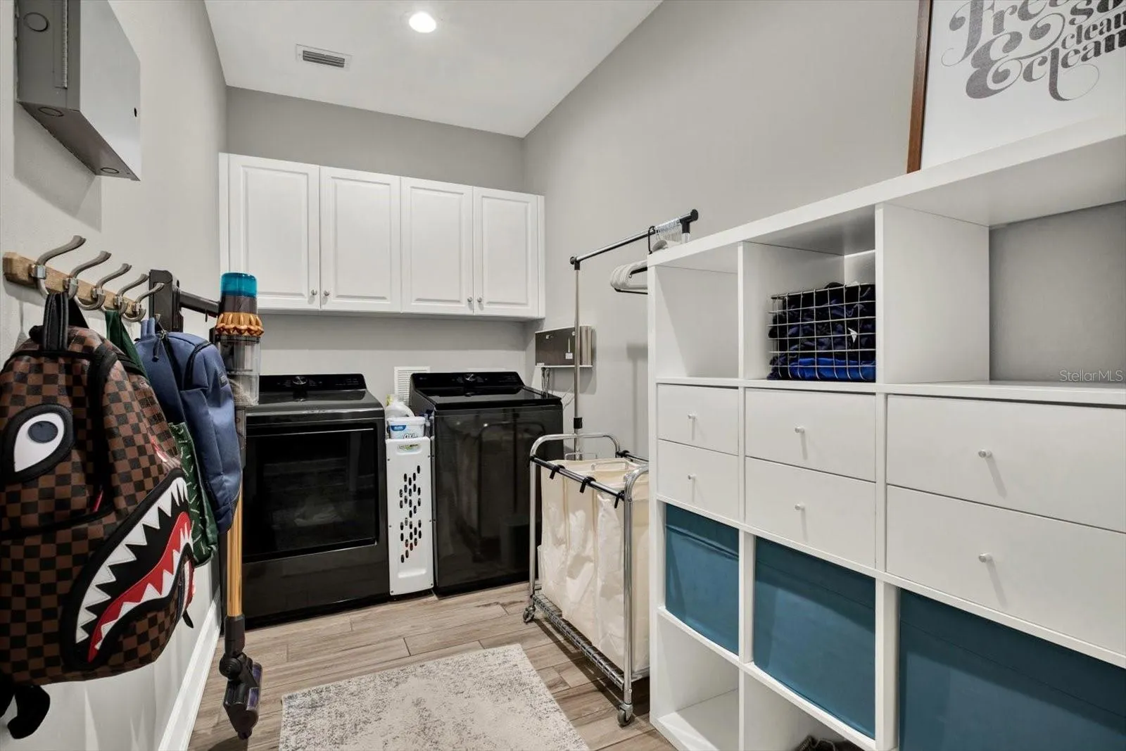 Inside utility room with ample storage and newer (2025) LG washer and dryer