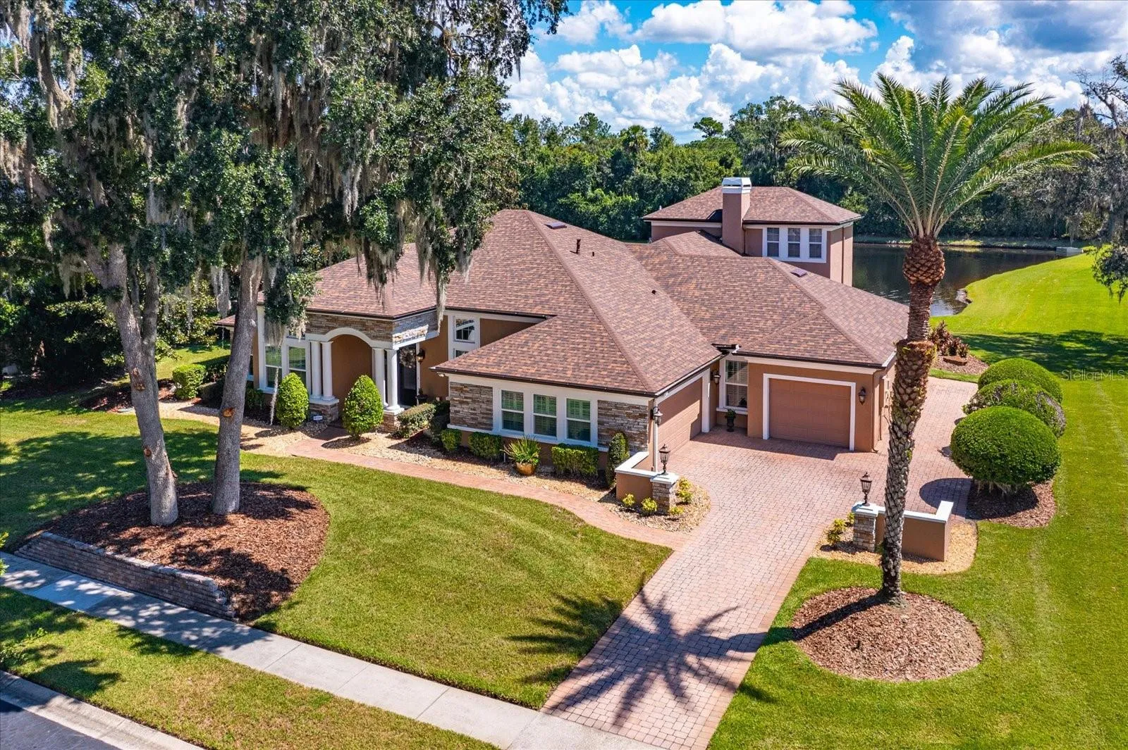 Updated Executive Pool Home in Ellington Estates with 4BR's 3BA's, Office, Bonus Rm and 4-Car Garage on a Pristine Pond!