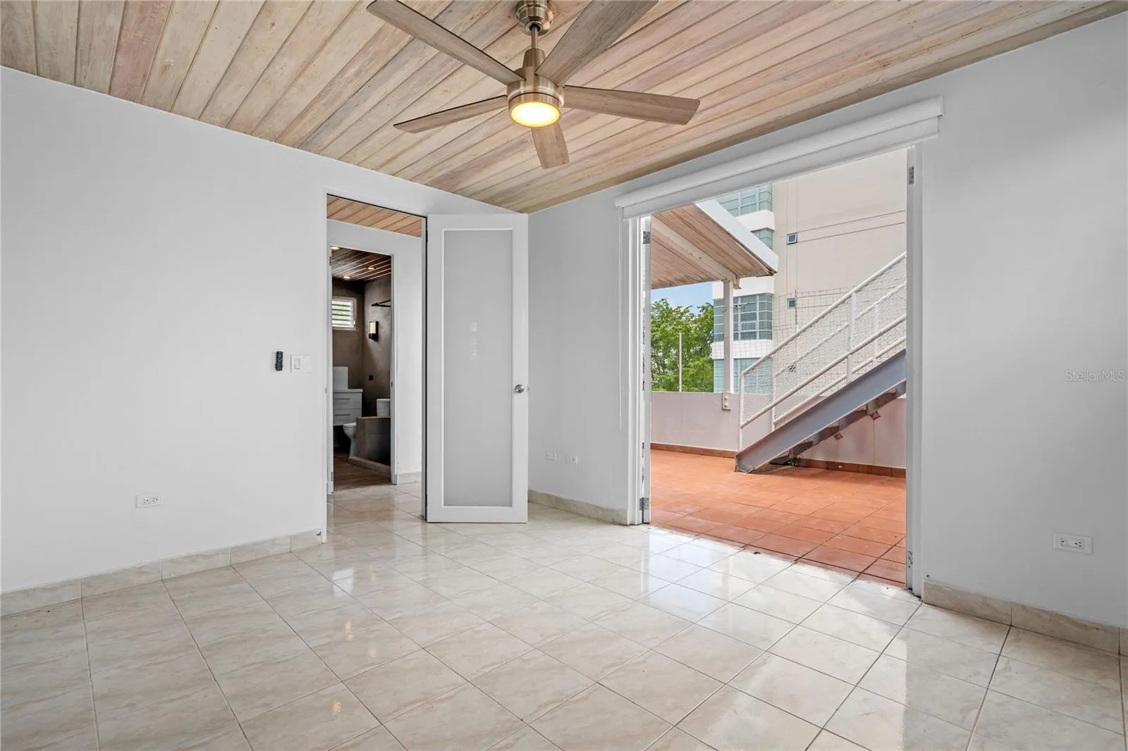 Third bedroom and back terrace access