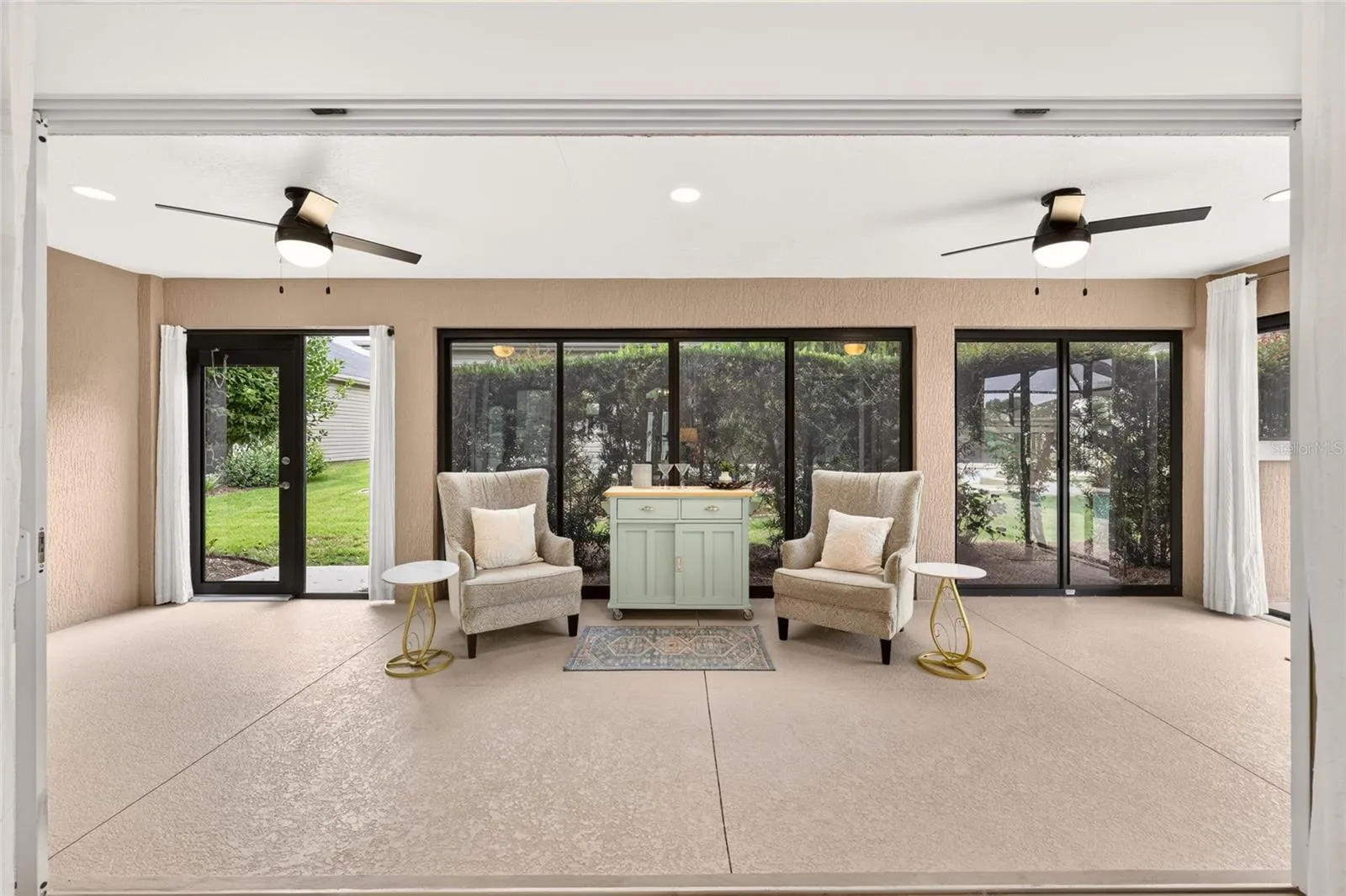 Glass Enclosed Florida Room with 2 Ceiling Fans