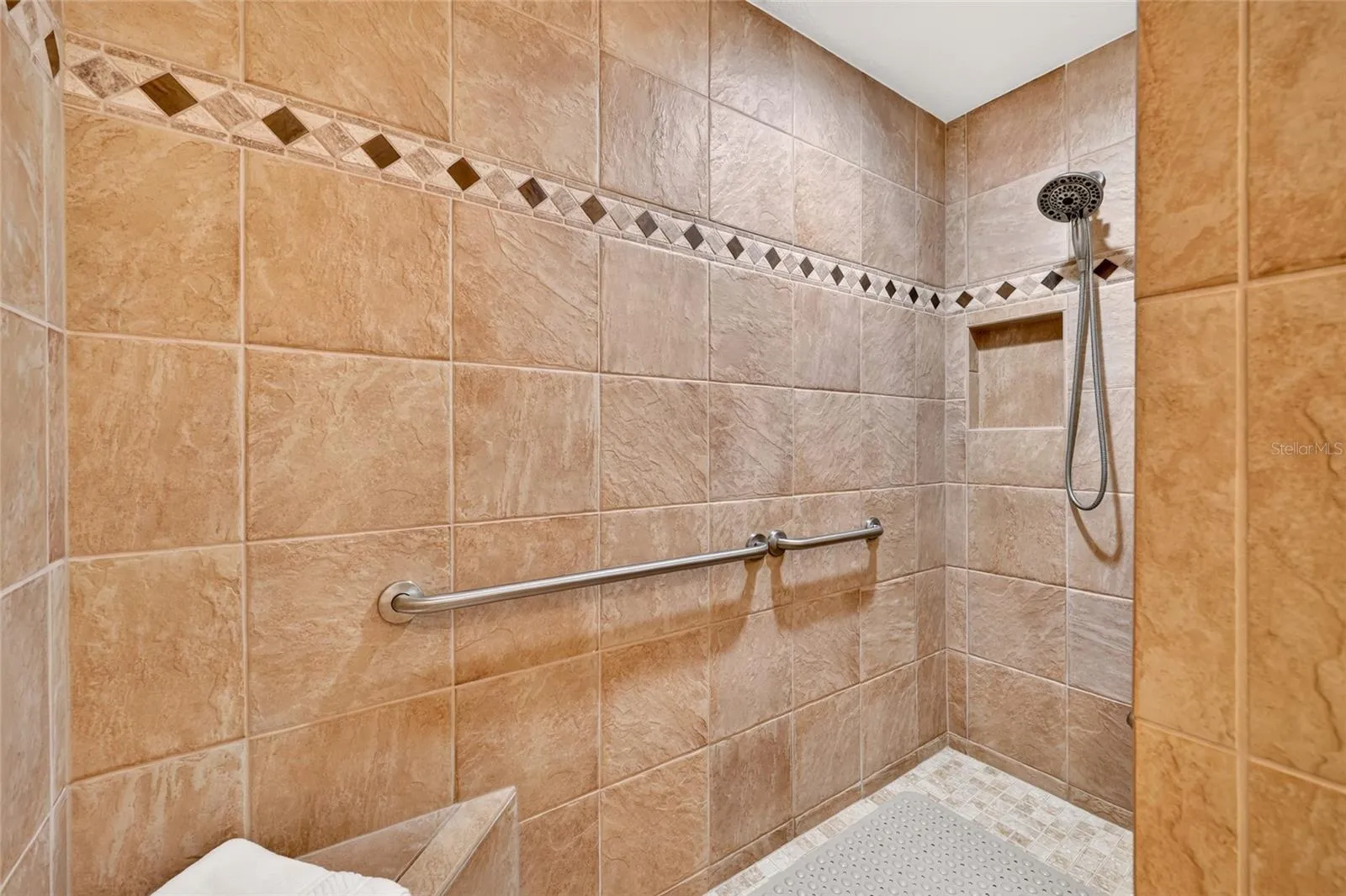 Walk-in Roman Shower with Grab Bars & Bench Seat