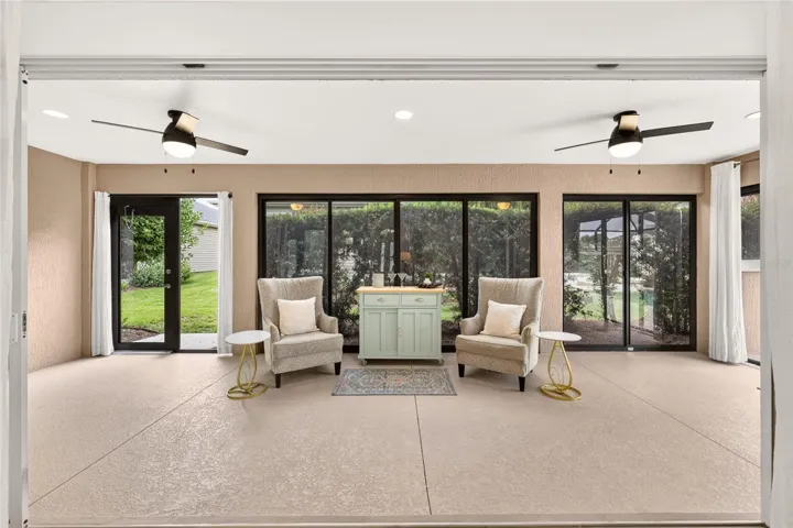 Glass Enclosed Florida Room with 2 Ceiling Fans