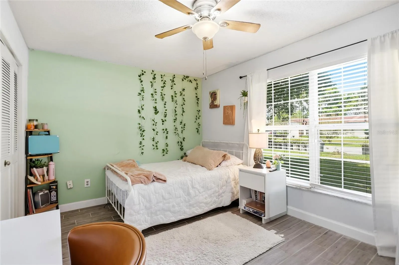 Natural light fills this bedroom, creating a welcoming place to unwind.