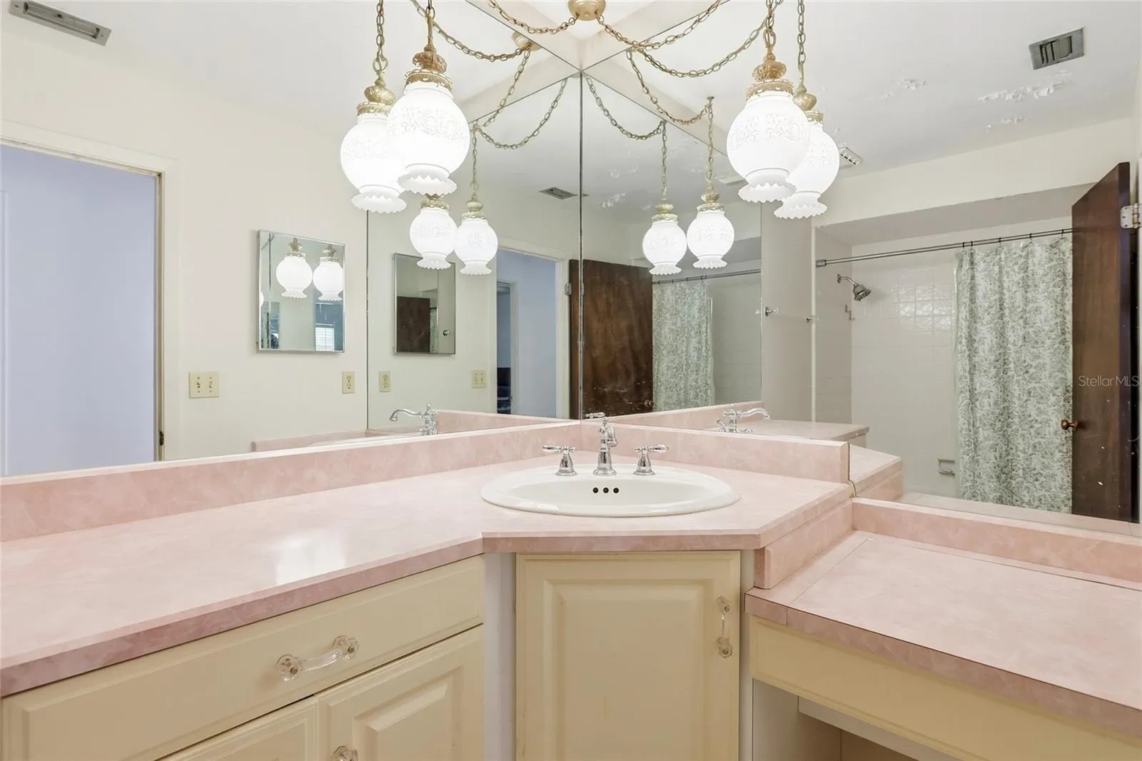 This original bathroom has hidden storage under the vanity counter!
