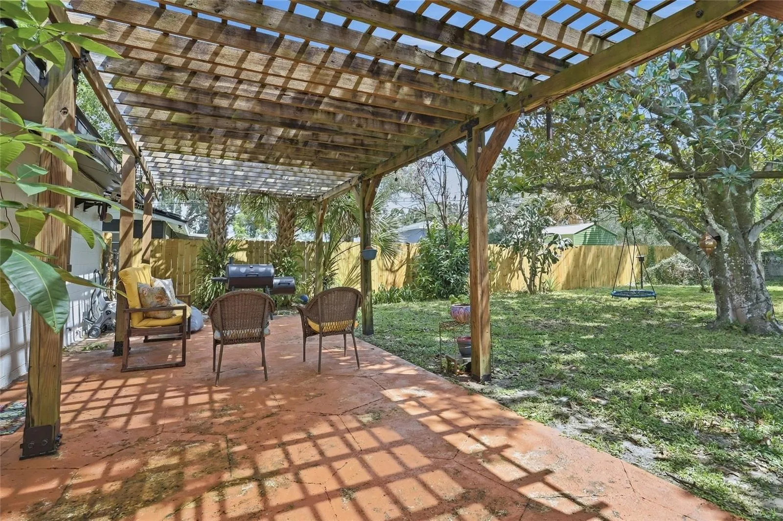Morning coffee finds its place on the pergola-covered patio.