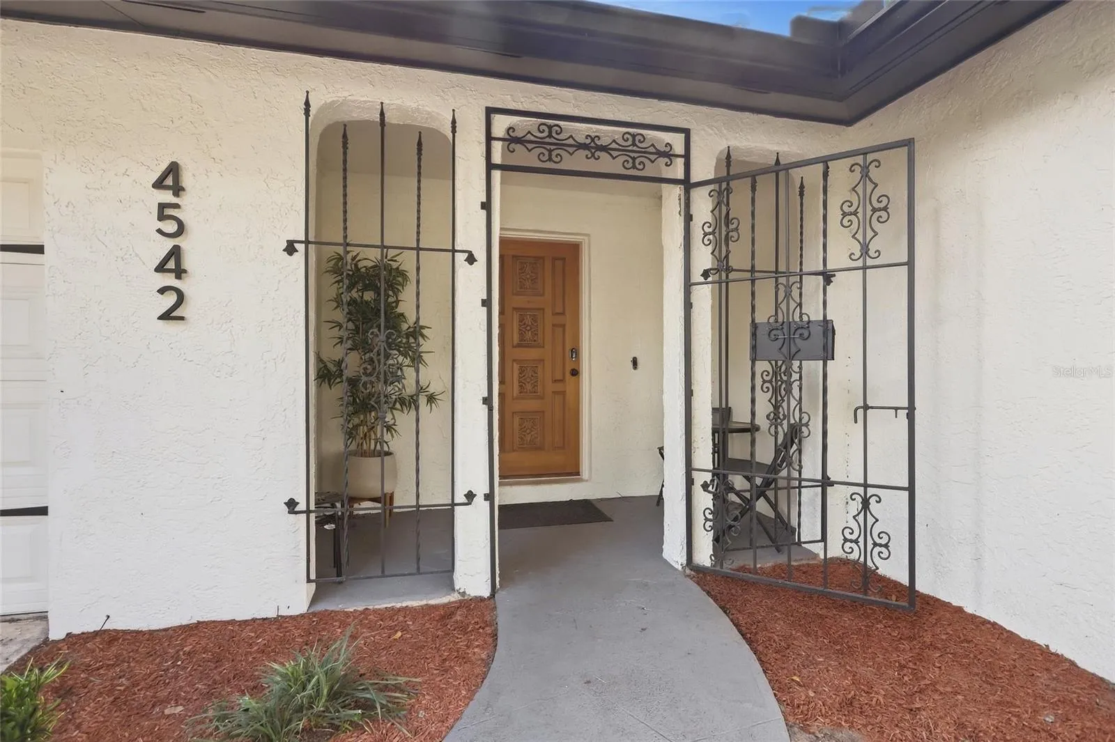A covered front entry welcomes you home to 4542 Flagg St.