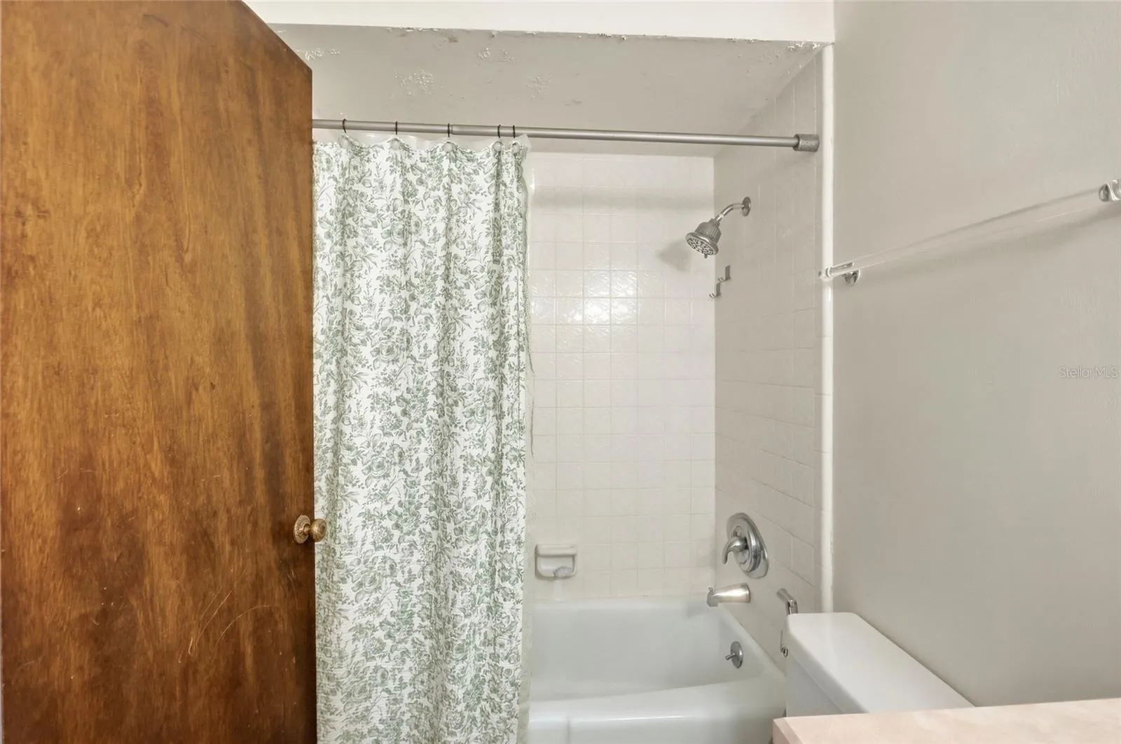 Refresh and recharge in the additional bathroom with a tub and shower combination.