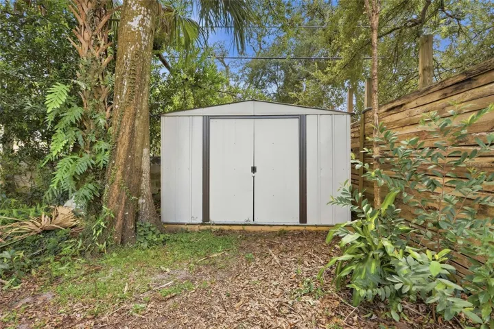 A backyard storage shed keeps garden tools and weekend projects nearby.