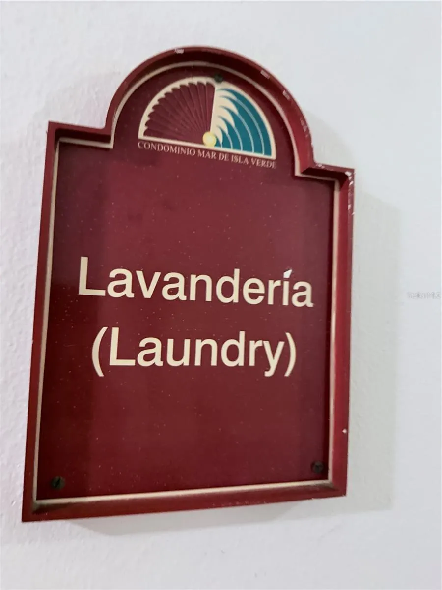 Laundry common area with washer and dryer machines