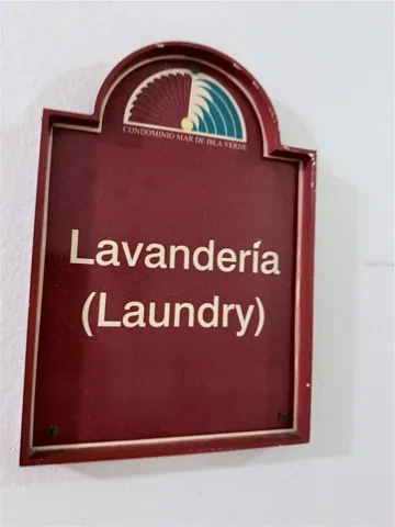 Laundry common area with washer and dryer machines