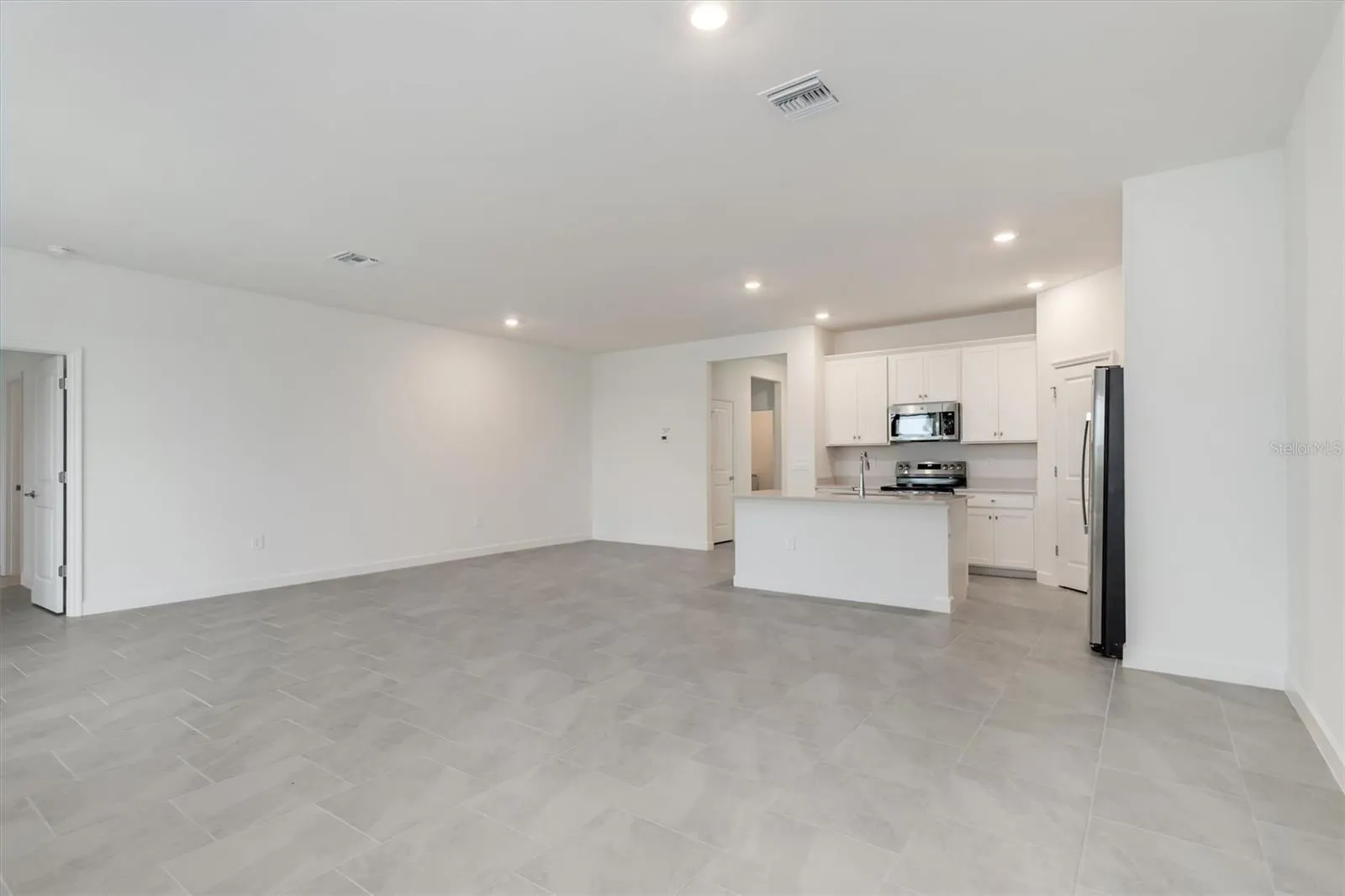 Looking back from living area to kitchen &amp; dining area