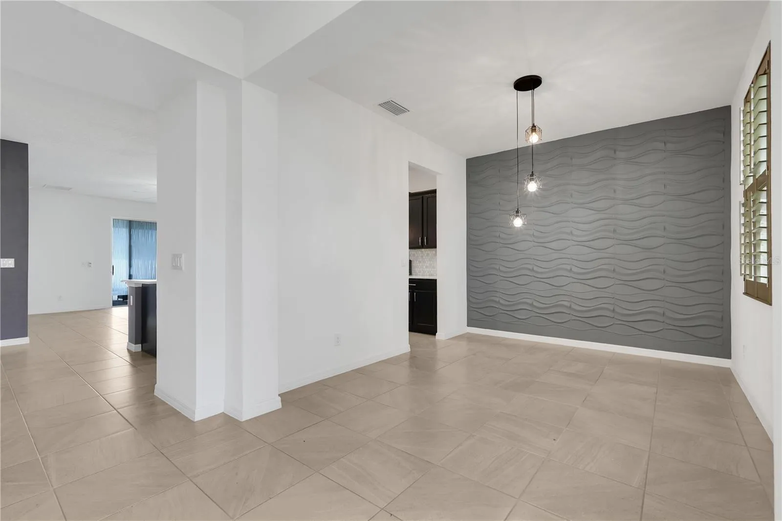 Dining room—or it could also be an office, playroom, or fourth bedroom.