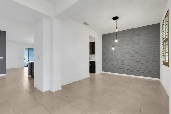 Dining room—or it could also be an office, playroom, or fourth bedroom.