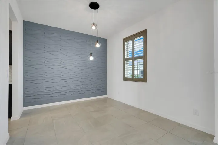 Dining room—or it could also be an office, playroom, or fourth bedroom.