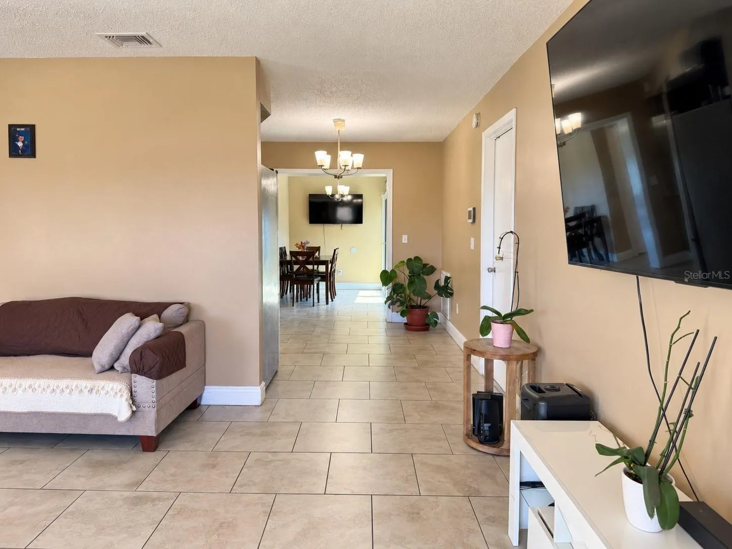 Open living area flowing into the dining room.