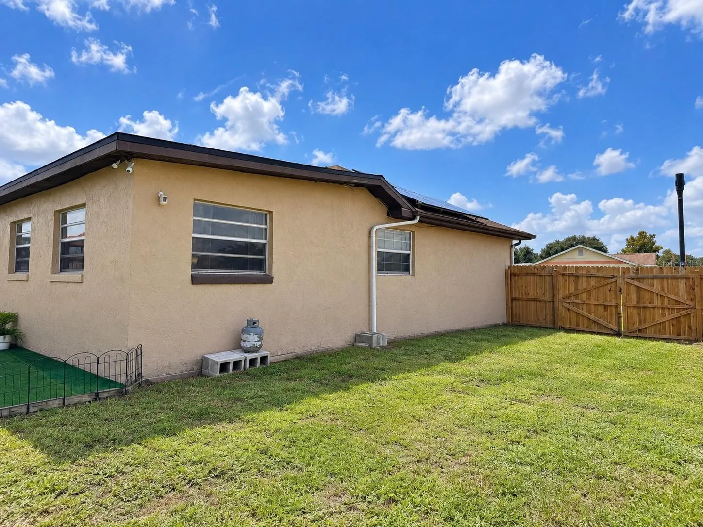 Large side yard with a separate entrance