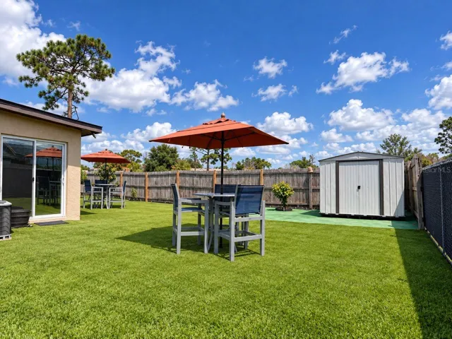 Spacious backyard with a Storage Shed!