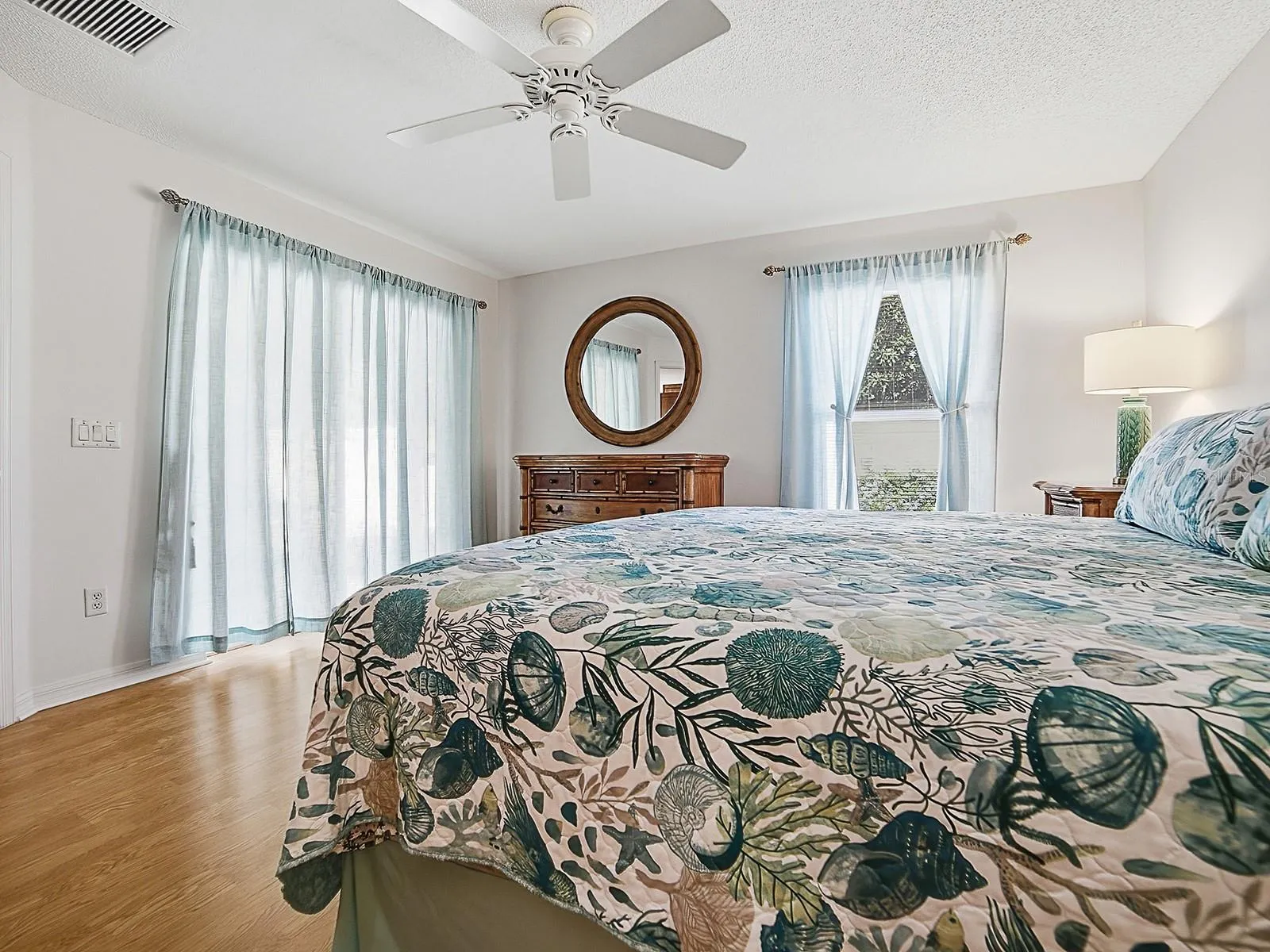 Primary bedroom with sliders to lanai