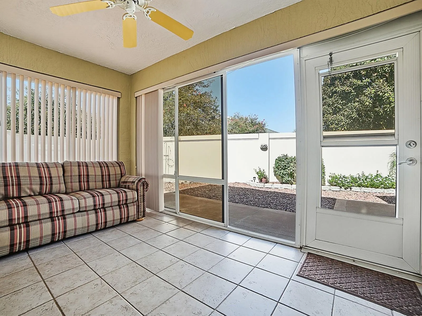 Acrylic enclosed lanai. Floor to ceiling windows open