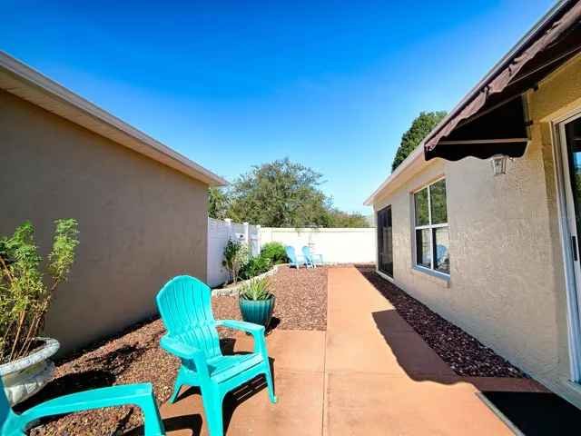 Another view of side courtyard to the back privacy fence