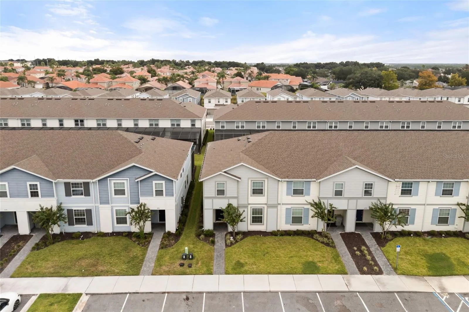 Aerial view of the property and the community