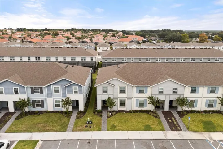 Aerial view of the property and the community