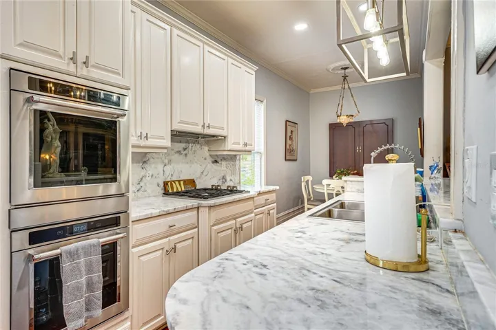 Kitchen with 1¼-Inch Granite Countertops and Double Ovens