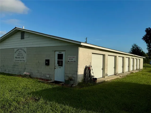 Entryway to office and side view of storage units
