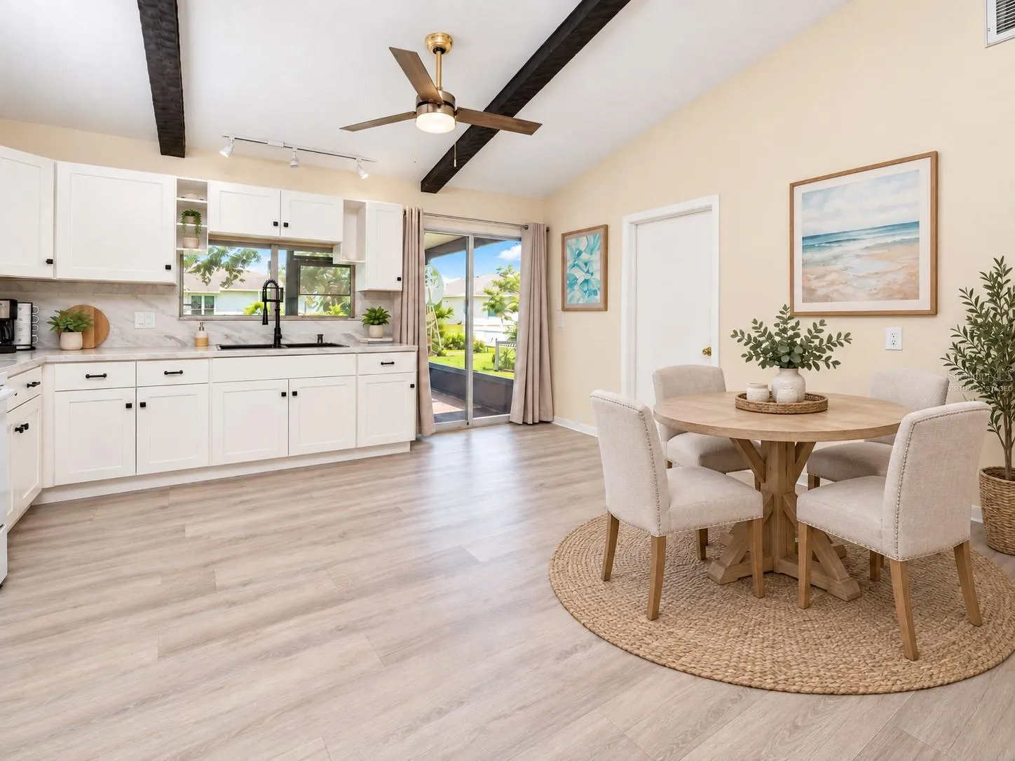 View of the dinette and kitchen.  VIRTUALLY STAGED.