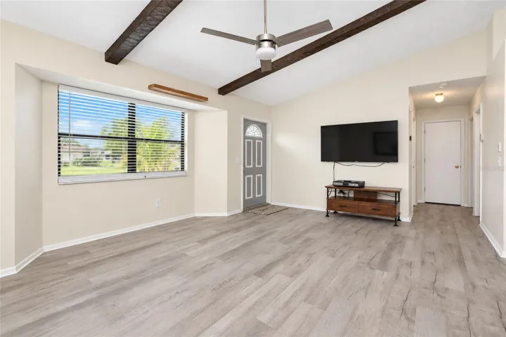 Living room.  the hallway leads to the bedrooms and full bath.