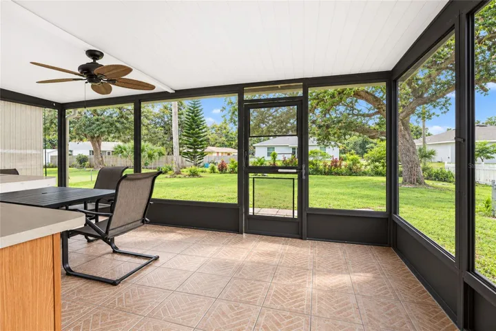 Rear, screened porch and fenced back yard.
