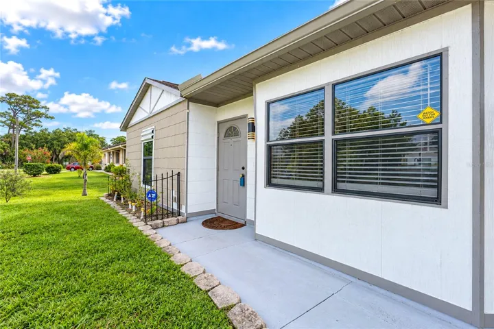Walk from the driveway to the front door.